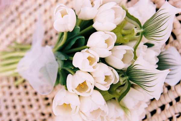 white and green tulip and orchid wedding bouquet photo by Yvette Roman Photography